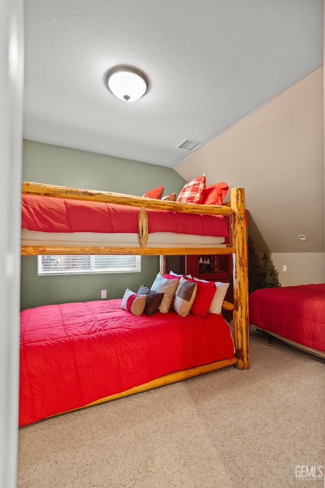 bedroom with lofted ceiling