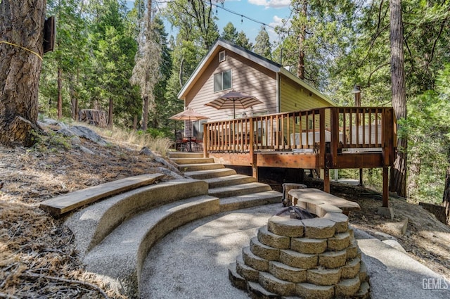 back of property with a wooden deck