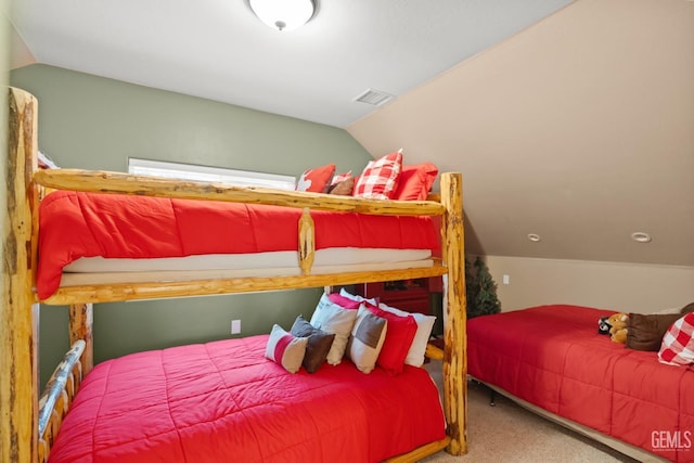 carpeted bedroom featuring vaulted ceiling