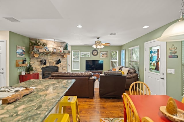 dining space with ceiling fan and dark hardwood / wood-style floors