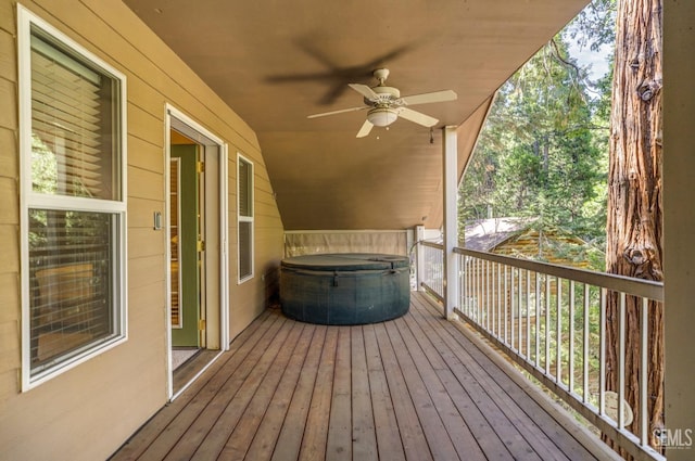 wooden deck featuring ceiling fan