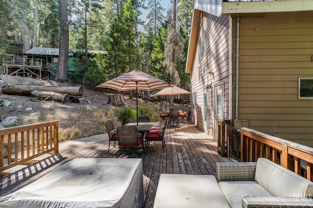 wooden terrace featuring an outdoor hangout area