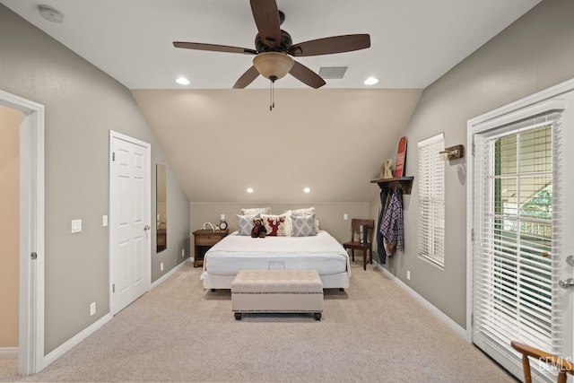 carpeted bedroom with ceiling fan and lofted ceiling