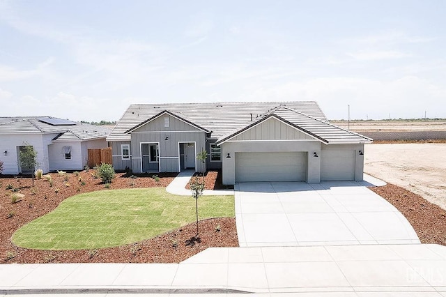 16717 Chloe Ct, Bakersfield, CA 93314 - modern inspired farmhouse with board and batten siding, concrete driveway, a tiled roof, and an attached garage