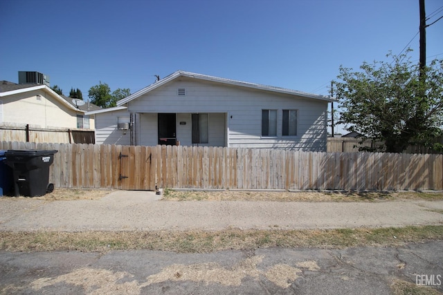 bungalow-style home with a fenced front yard