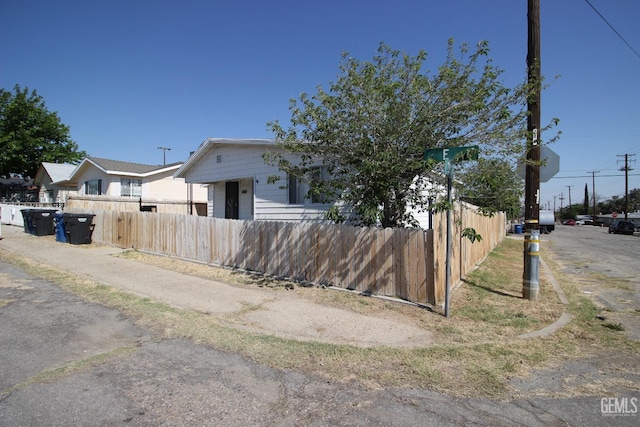 view of front of property featuring fence