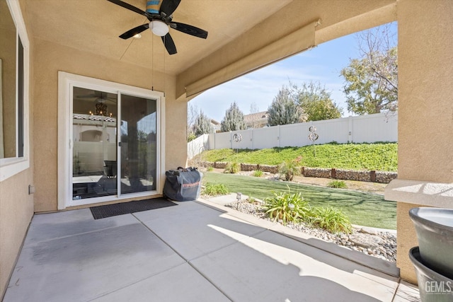 view of patio / terrace with a fenced backyard and a ceiling fan