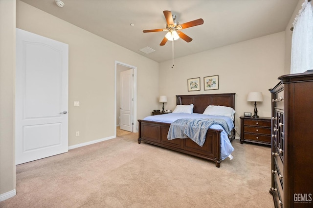 bedroom with baseboards, a ceiling fan, and light colored carpet