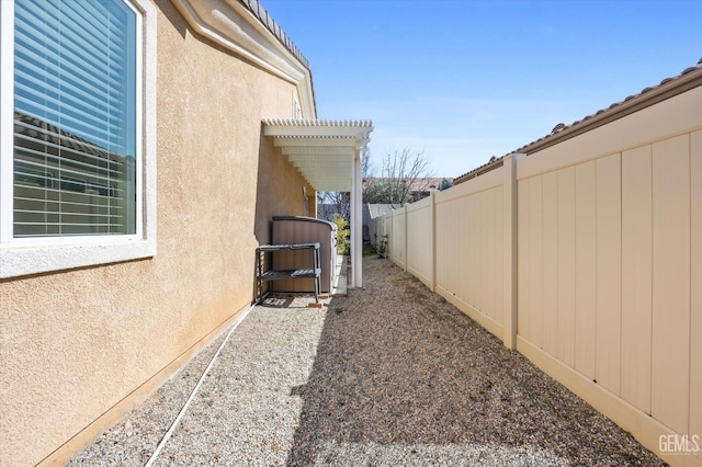 view of yard with a fenced backyard and a pergola