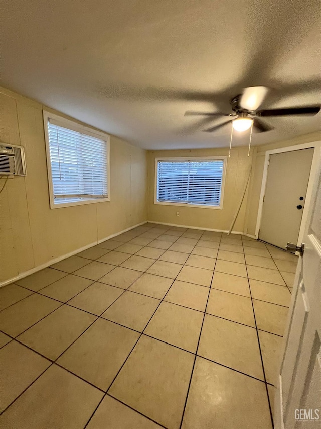 1208 W Point Dr, Bakersfield, CA 93305 - empty room with a textured ceiling, light tile patterned floors, and a ceiling fan