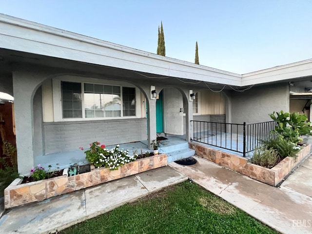 1208 W Point Dr, Bakersfield, CA 93305 - view of front of home with stucco siding and covered porch