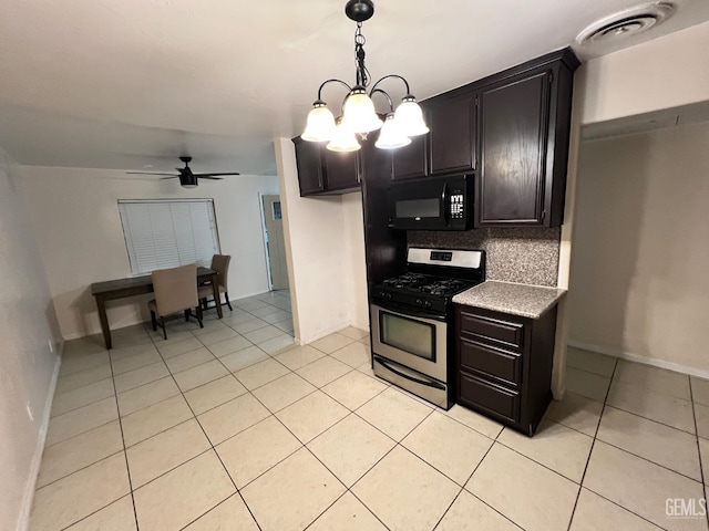 1208 W Point Dr, Bakersfield, CA 93305 - kitchen featuring stainless steel gas range, black microwave, decorative backsplash, a ceiling fan, and a chandelier