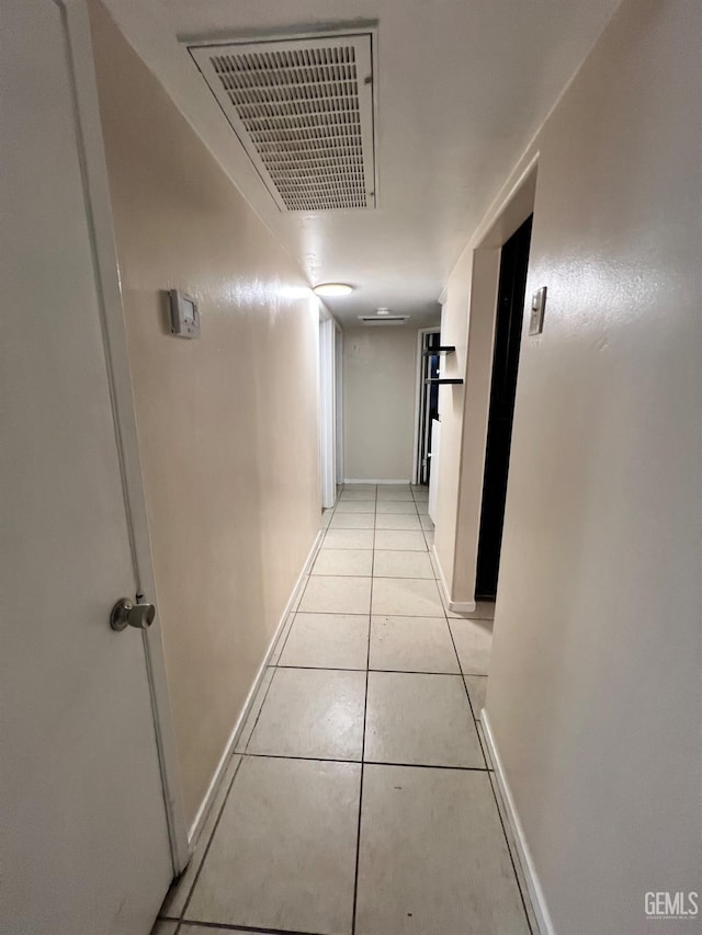 1208 W Point Dr, Bakersfield, CA 93305 - corridor featuring light tile patterned flooring and baseboards