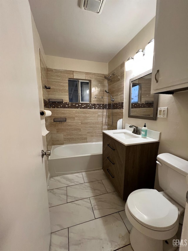 1208 W Point Dr, Bakersfield, CA 93305 - bathroom featuring toilet, marble look tile flooring, washtub / shower combination, and vanity