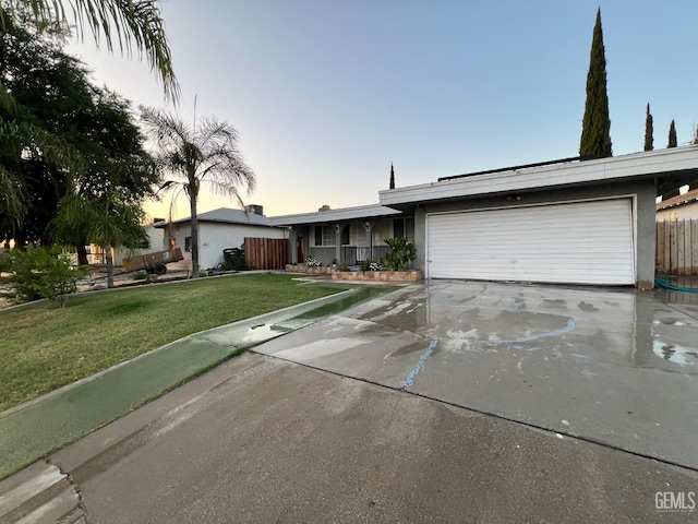 1208 W Point Dr, Bakersfield, CA 93305 - ranch-style house featuring an attached garage, driveway, and stucco siding