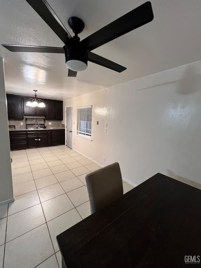 1208 W Point Dr, Bakersfield, CA 93305 - dining space featuring a ceiling fan, light tile patterned flooring, and baseboards