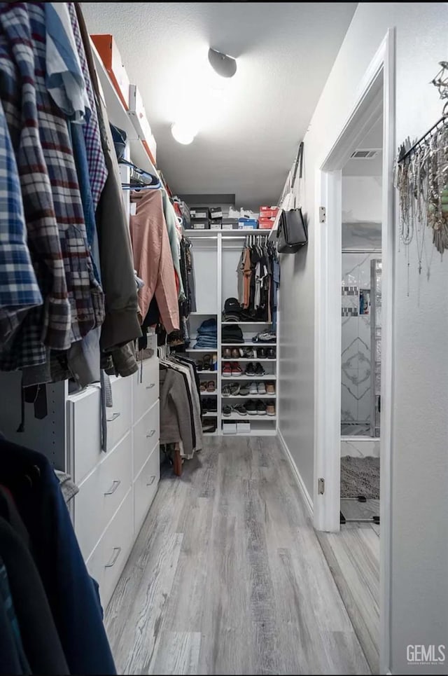 6513 Derby Dr, Bakersfield, CA 93306 - walk in closet with wood finished floors