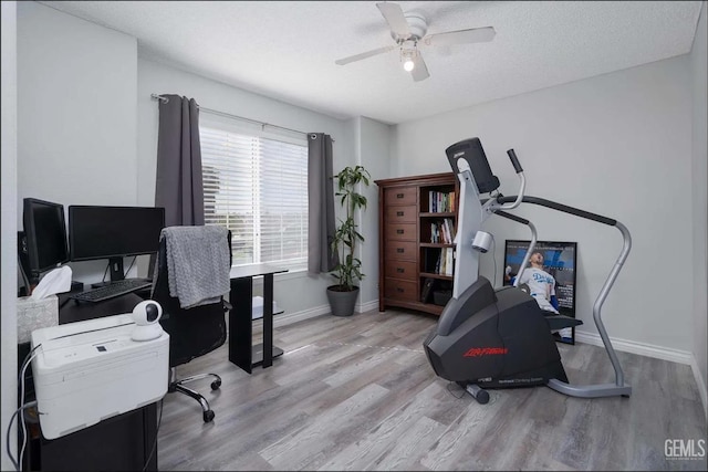 6513 Derby Dr, Bakersfield, CA 93306 - home office with light wood-type flooring, ceiling fan, and a textured ceiling
