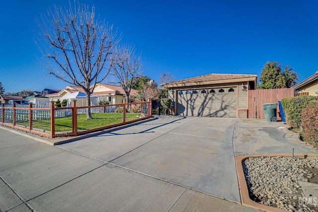 single story home featuring a garage and a front yard