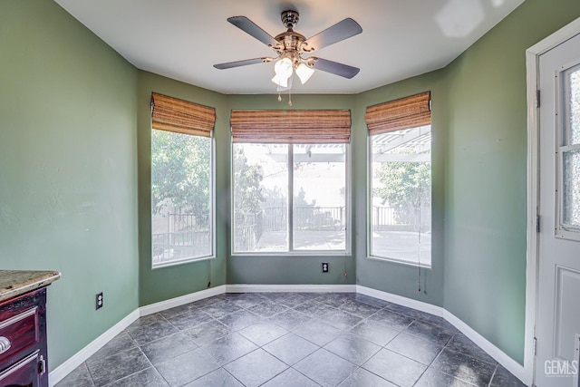 unfurnished dining area with ceiling fan