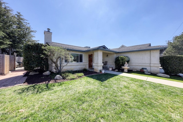 22824 Mariposa Rd, Tehachapi, CA 93561 - ranch-style home with a chimney, a shingled roof, fence, and a front lawn