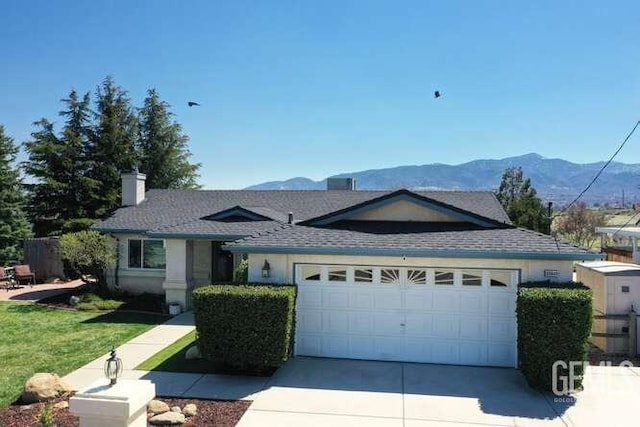 22824 Mariposa Rd, Tehachapi, CA 93561 - single story home featuring concrete driveway, an attached garage, a mountain view, a front lawn, and a shingled roof