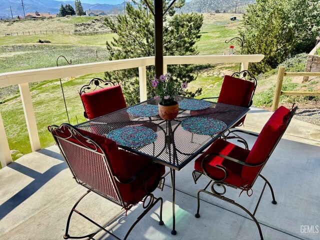 22824 Mariposa Rd, Tehachapi, CA 93561 - view of patio with outdoor dining area, a mountain view, and a rural view