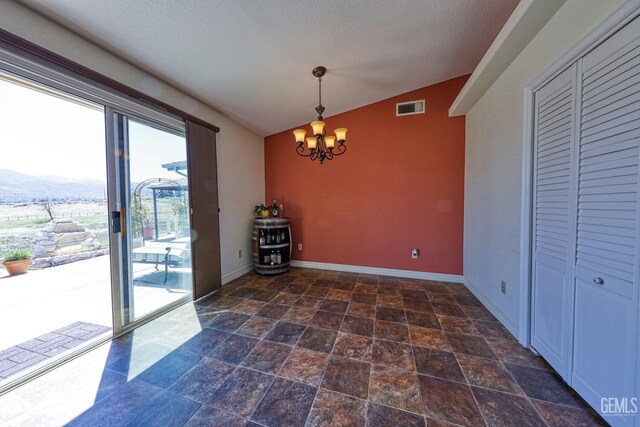 22824 Mariposa Rd, Tehachapi, CA 93561 - unfurnished dining area with baseboards, visible vents, a notable chandelier, and vaulted ceiling