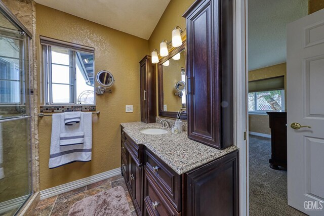 22824 Mariposa Rd, Tehachapi, CA 93561 - bathroom featuring plenty of natural light, a textured wall, baseboards, and vanity