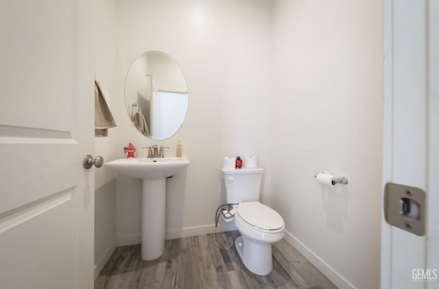 15920 Waterford St, Bakersfield, CA 93314 - bathroom featuring wood finished floors and toilet