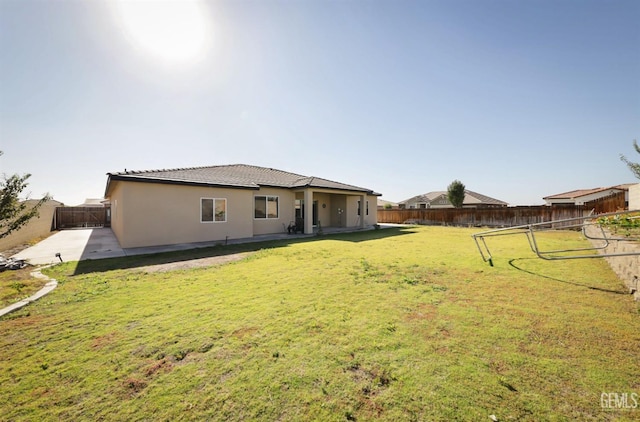 15920 Waterford St, Bakersfield, CA 93314 - rear view of property featuring stucco siding, a fenced backyard, and a patio area