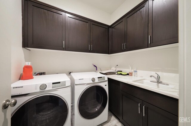 15920 Waterford St, Bakersfield, CA 93314 - washroom featuring separate washer and dryer, cabinet space, and light wood-type flooring