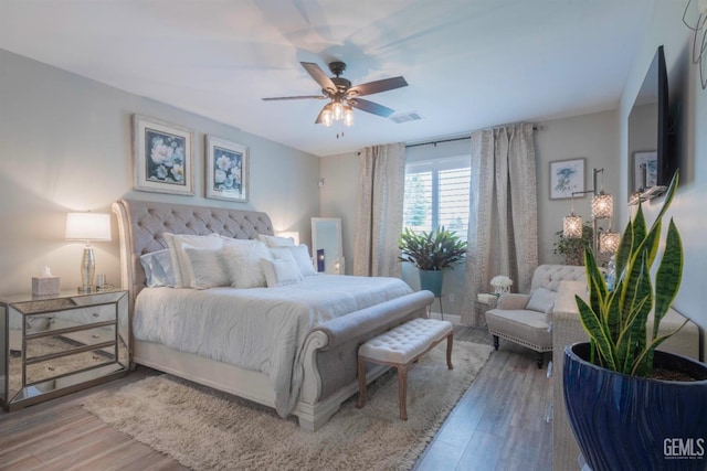 bedroom featuring ceiling fan and hardwood / wood-style floors