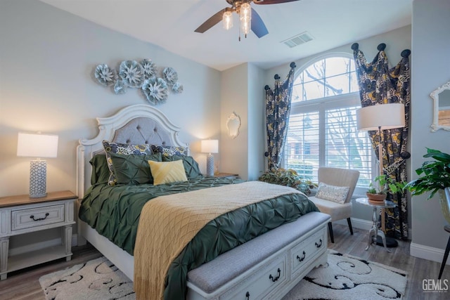 bedroom featuring ceiling fan and light hardwood / wood-style flooring