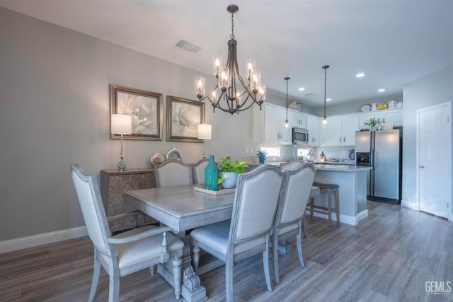 dining room with dark hardwood / wood-style flooring