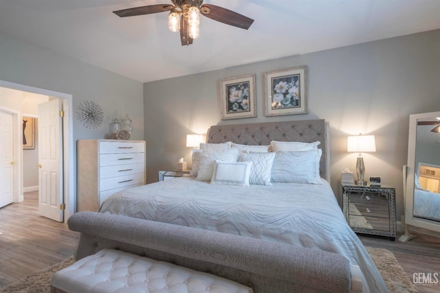 bedroom with hardwood / wood-style flooring and ceiling fan