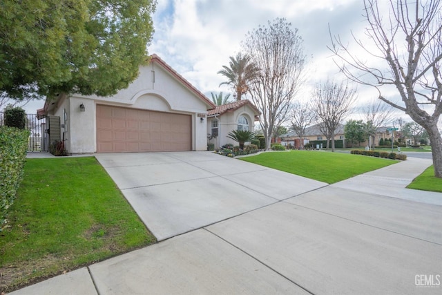 view of front of house with a garage and a front lawn