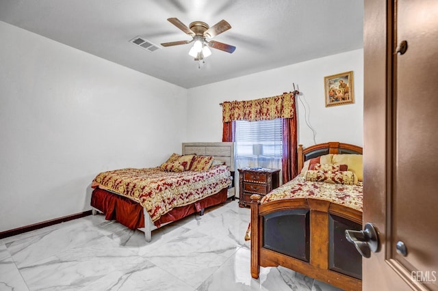 28124 Mustang Ave, Taft, CA 93268 - bedroom featuring light marble finish floors, ceiling fan, and baseboards