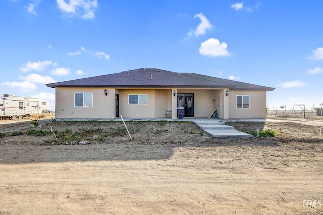 28124 Mustang Ave, Taft, CA 93268 - view of front facade with stucco siding and roof with shingles