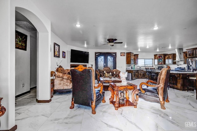 28124 Mustang Ave, Taft, CA 93268 - living area featuring recessed lighting, a ceiling fan, light marble finish flooring, baseboards, and arched walkways