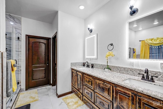 28124 Mustang Ave, Taft, CA 93268 - full bathroom featuring marble finish flooring, a shower stall, double vanity, and baseboards
