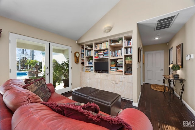 living area featuring french doors, lofted ceiling, visible vents, dark wood-type flooring, and baseboards