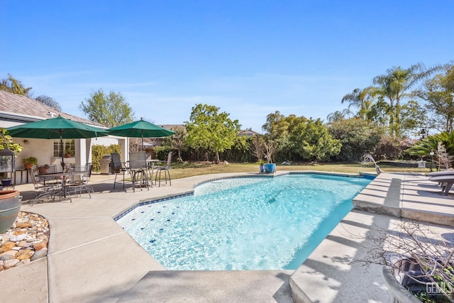 pool with a patio