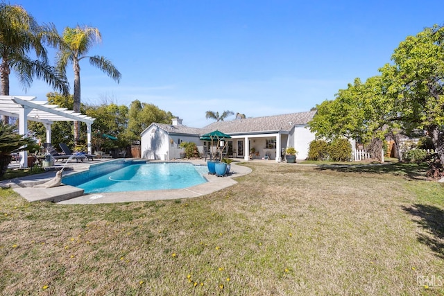 outdoor pool with a lawn, a pergola, and a patio