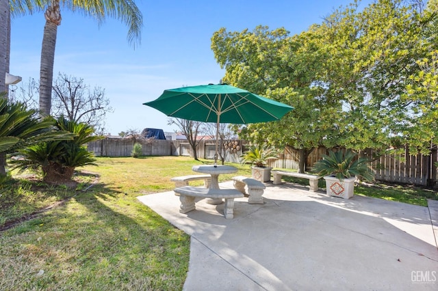 view of yard featuring a patio area and a fenced backyard