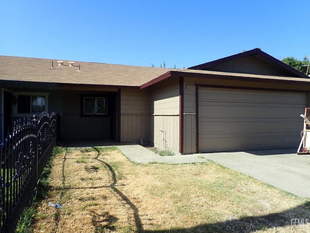 1736 17th Ave, Delano, CA 93215 - ranch-style home featuring a garage, concrete driveway, and roof with shingles
