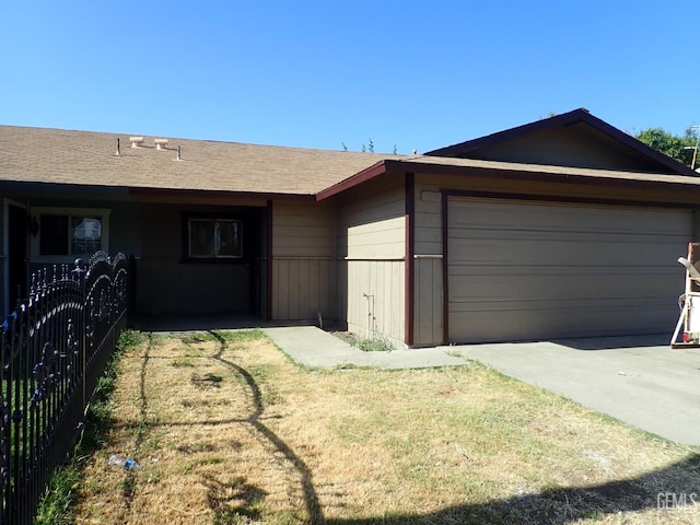 1736 17th Ave, Delano, CA 93215 - ranch-style home featuring a garage, concrete driveway, and roof with shingles