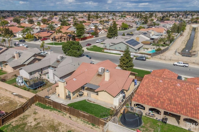 birds eye view of property with a residential view