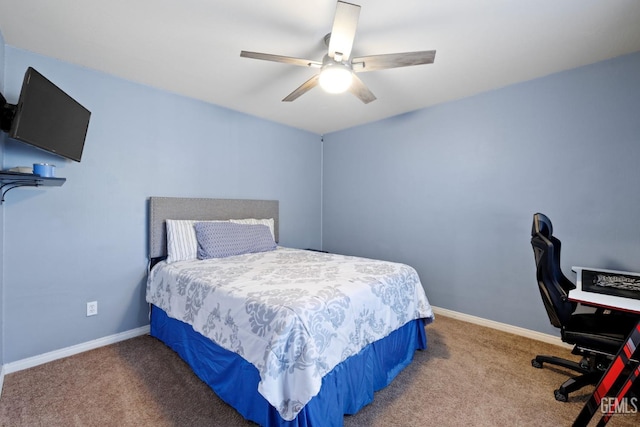 carpeted bedroom featuring a ceiling fan and baseboards