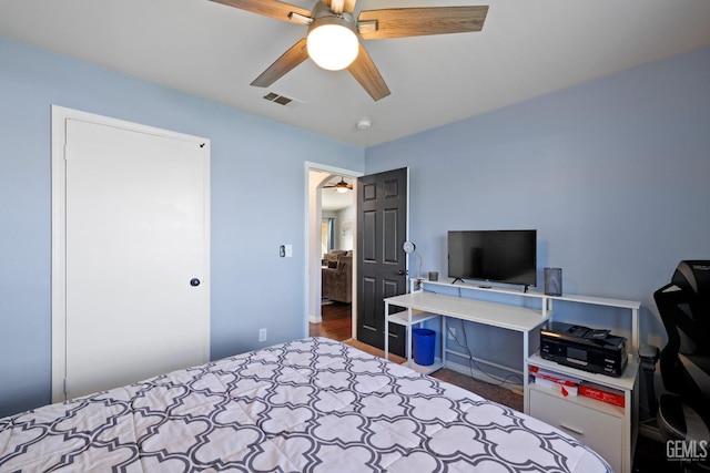 bedroom featuring ceiling fan and visible vents